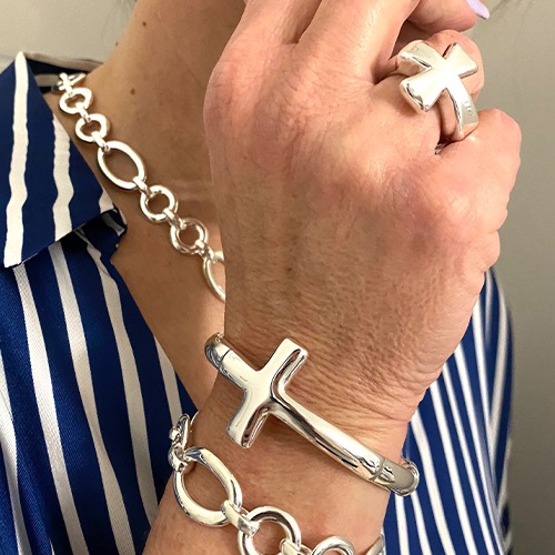 Sterling silver bold cross design hinge bangle