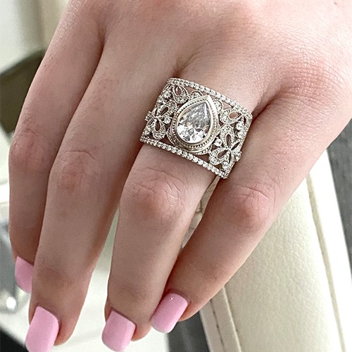 Sterling silver detailed cubic zirconia band ring with center teardrop stone 17mm wide