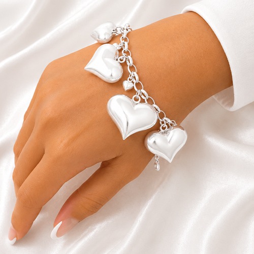 Sterling silver bulky multi size heart charm bracelet